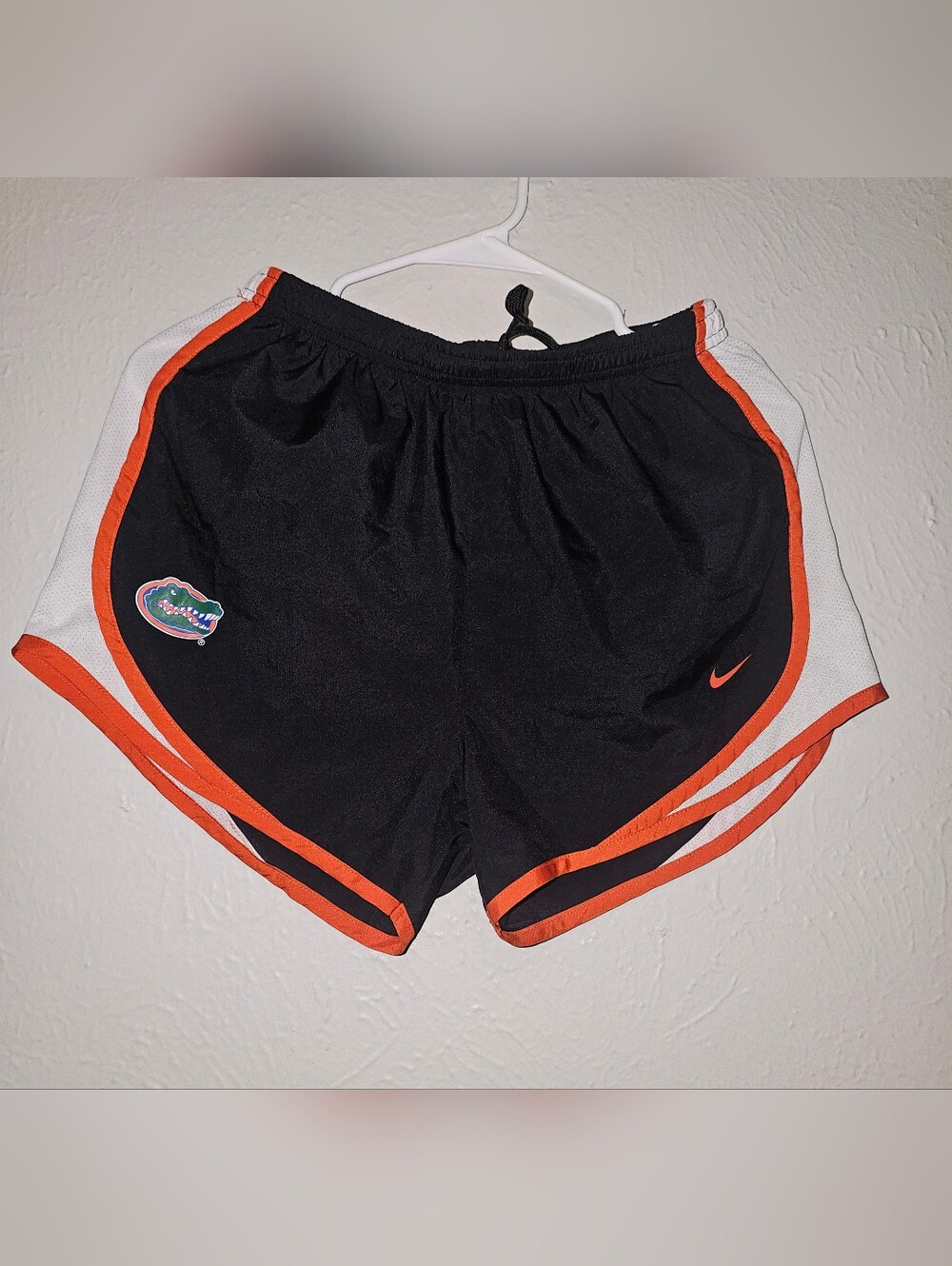 Nike Women’s Black and Orange Athletic Shorts with Team Patch